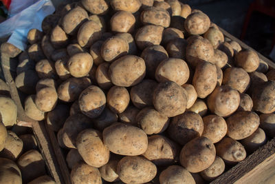 High angle view of onions for sale at market stall