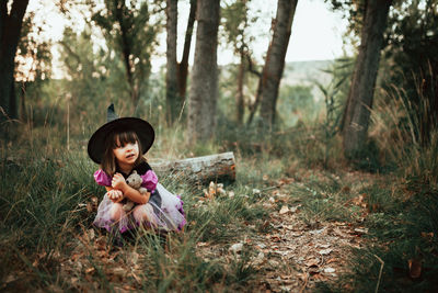 Girl sitting in a forest