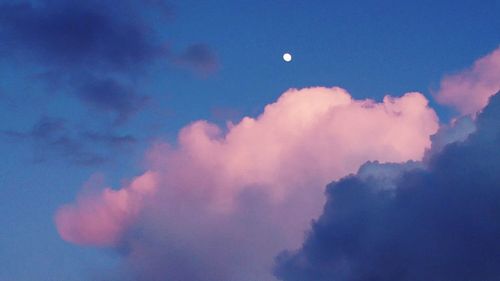 Low angle view of moon in sky at night