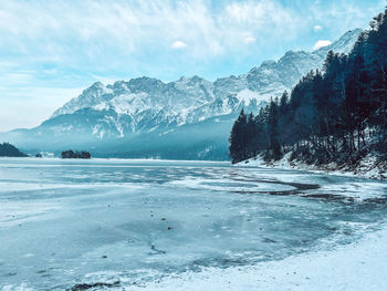 Scenic view of snowcapped mountains against sky