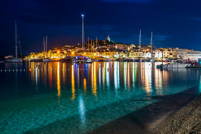 Boats in sea at night