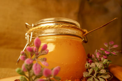 Close-up of pink flowers in jar on table