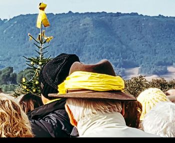 Rear view of person in sea against sky