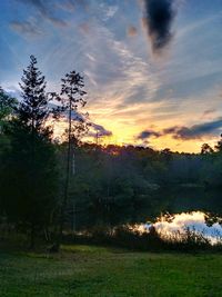 Scenic view of field against sky during sunset