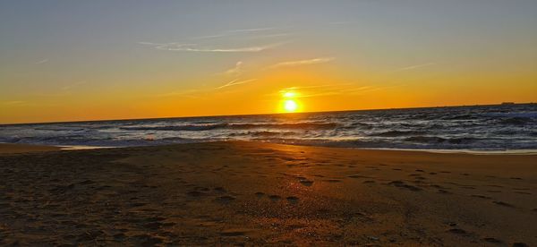 Scenic view of sea against sky during sunset