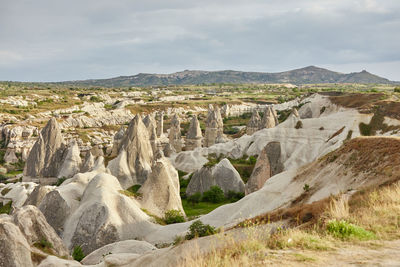 Panoramic view of rock formations against sky