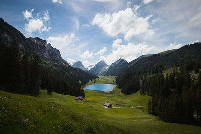 Scenic view of landscape and mountains against sky