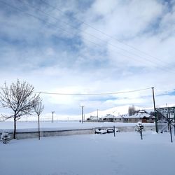 Scenic view of snow covered mountains against sky