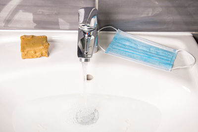 High angle view of faucet in bathroom