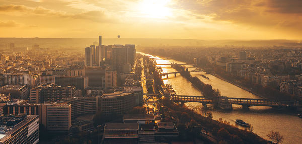 High angle view of city buildings during sunset