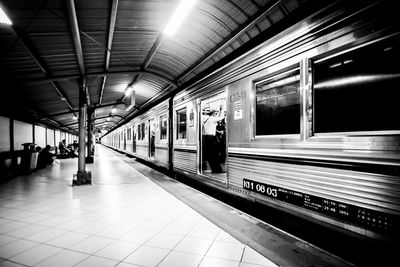 Train moving by railroad station platform