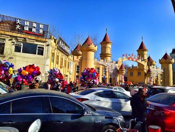 View of cars parked in city