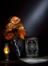 Close-up of roses in vase on table