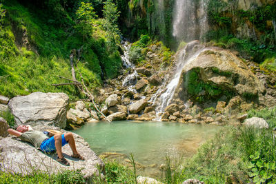 Scenic view of waterfall in forest