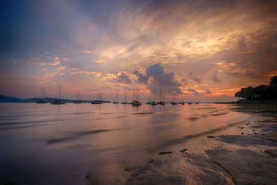 Scenic view of sea against sky at sunset