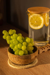 Green grapes lie on eco dish. eco-friendly choice and friendly nature. the concept of world without