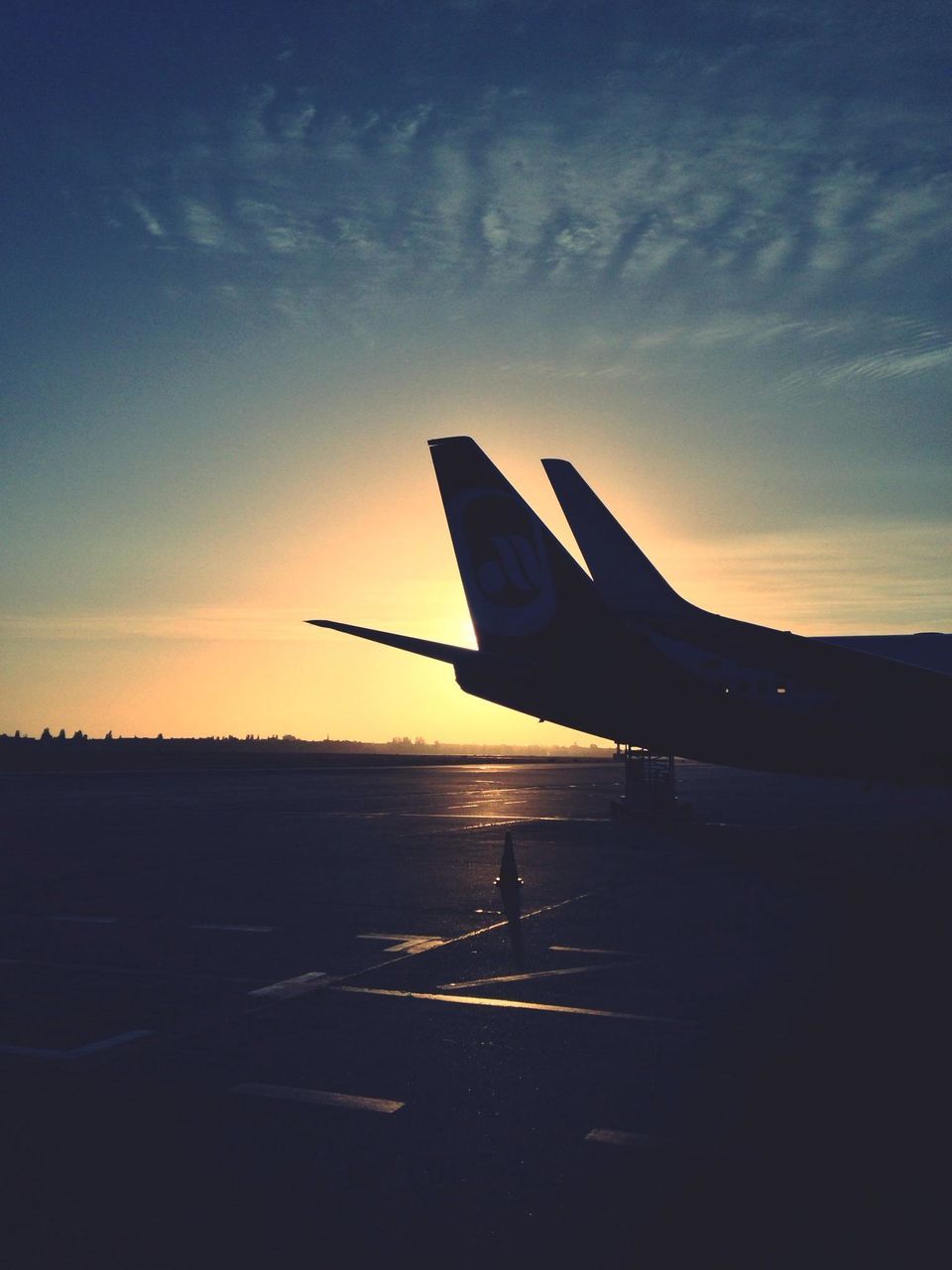 transportation, mode of transport, airplane, sunset, sky, silhouette, air vehicle, flying, on the move, travel, cloud - sky, aircraft wing, sunlight, journey, landscape, nature, outdoors, no people, cloud, beauty in nature