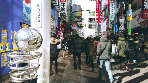 People walking on street in city