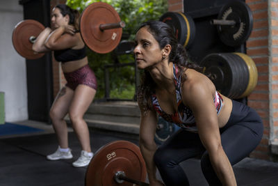 Portrait of woman exercising in gym