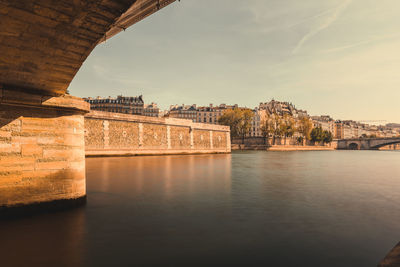 Scenic view of the seine river in paris in autumn warm light