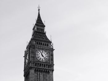 Low angle view of clock tower against clear sky