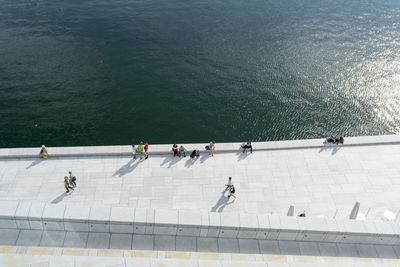 High angle view of people on swimming pool