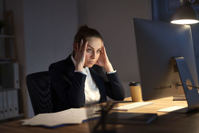 Businesswoman working at desk in office