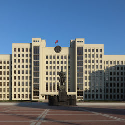 Low angle view of buildings against blue sky