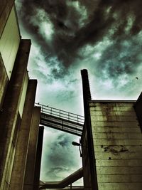 Low angle view of building against cloudy sky