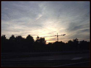 Scenic view of landscape against sky at sunset