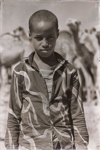 Portrait of boy standing outdoors