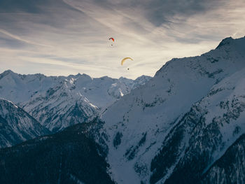 Scenic view of snowcapped mountains against sky