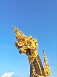 Low angle view of statue against sky