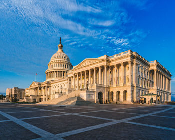 View of historic capitol building against blue sky