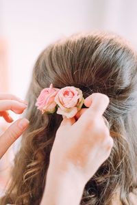 Close-up of woman holding rose