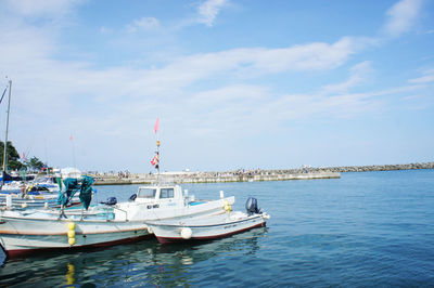 Boats moored at harbor