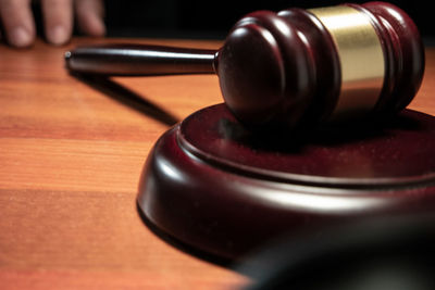 Close-up of hand on table