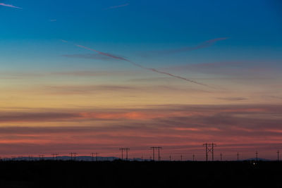 Scenic view of silhouette landscape against sky during sunset