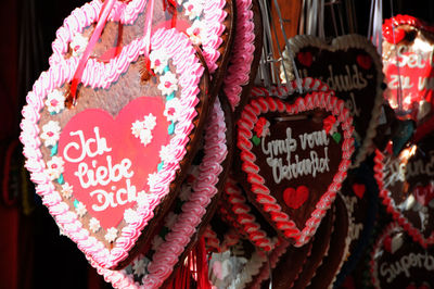 Close-up of heart shape decorations hanging at market