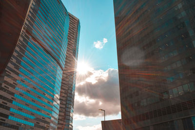 Low angle view of modern buildings against sky