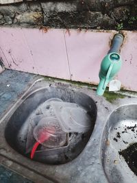 High angle view of water bottle in container