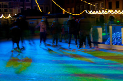 Reflection of illuminated buildings in water