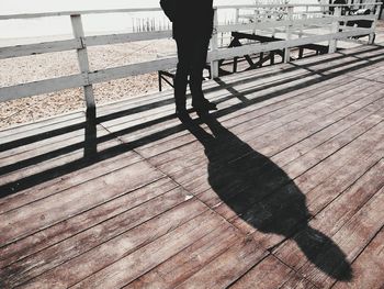 Low section of person walking on footpath