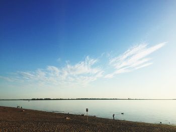 Scenic view of sea against blue sky