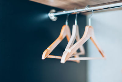 Close-up of clothespins hanging on rope