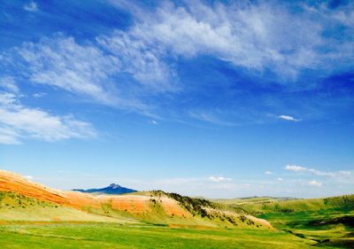 Scenic view of landscape against cloudy sky