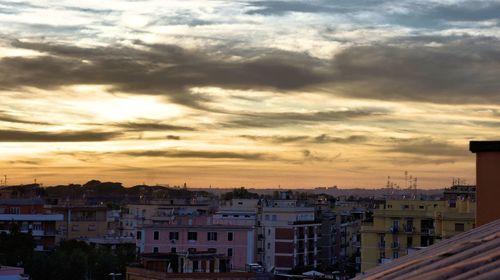 High angle view of buildings against sky during sunset