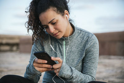 Smiling girl watching her mobile