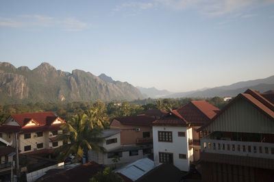 Houses in town against sky