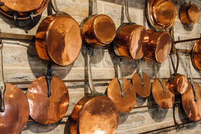 Utensils hanging on wooden wall for sale